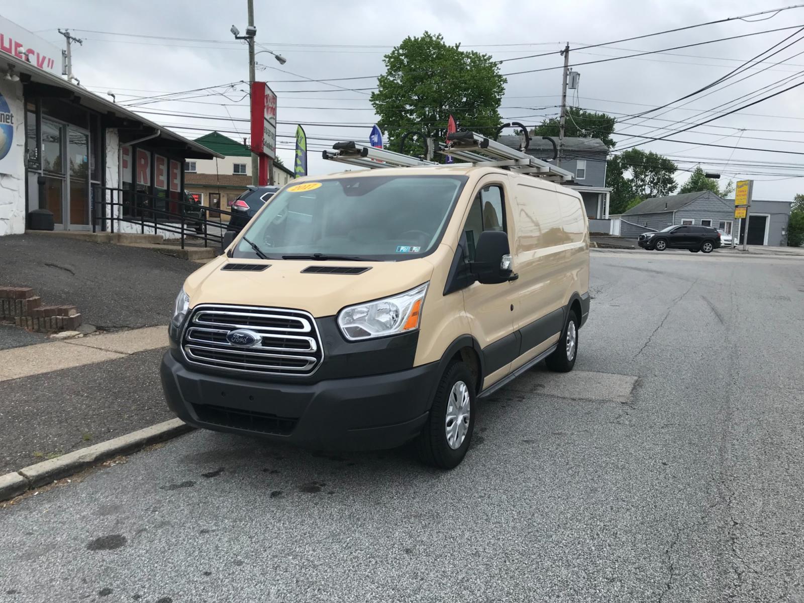 2017 Tan /Gray Ford Transit 150 (1FTYE1YM0HK) with an 3.7 V6 engine, Automatic transmission, located at 577 Chester Pike, Prospect Park, PA, 19076, (610) 237-1015, 39.886154, -75.302338 - 2017 Ford Transit 150: Ladder racks, multiple pieces of shelving, backup camera, partition, power locks and windows, FLEET MAINTAINED, runs LIKE NEW! This vehicle comes inspected and has been given a bumper to bumper safety check. It is very clean, reliable, and well maintained. We offer a unique - Photo #2
